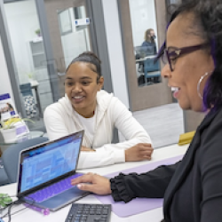 students with a laptop